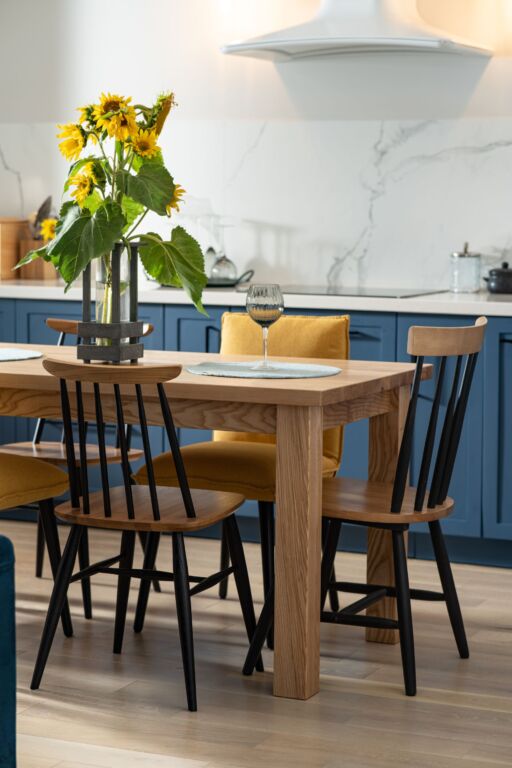 Sunflowers on wooden table in cosy kitchen