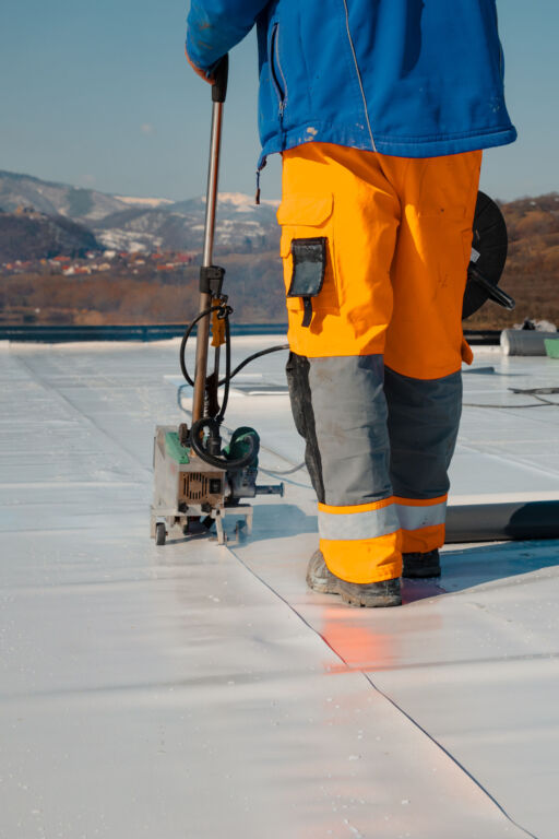 Waterproofing and insulation at construction site, waterproofing membrane preventing water penetration. Exterior vapor barrier for roof.